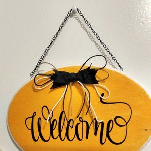 Halloween inspired welcome door hanger